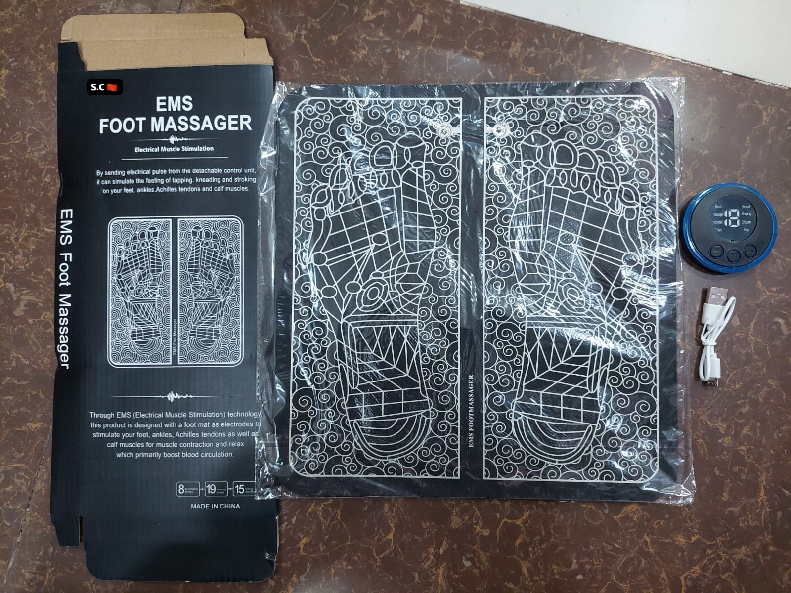 Black EMS foot massager mat with smart display controller for blood circulation