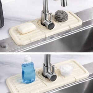 Silicone sink faucet mat catching water splashes around a modern kitchen sink